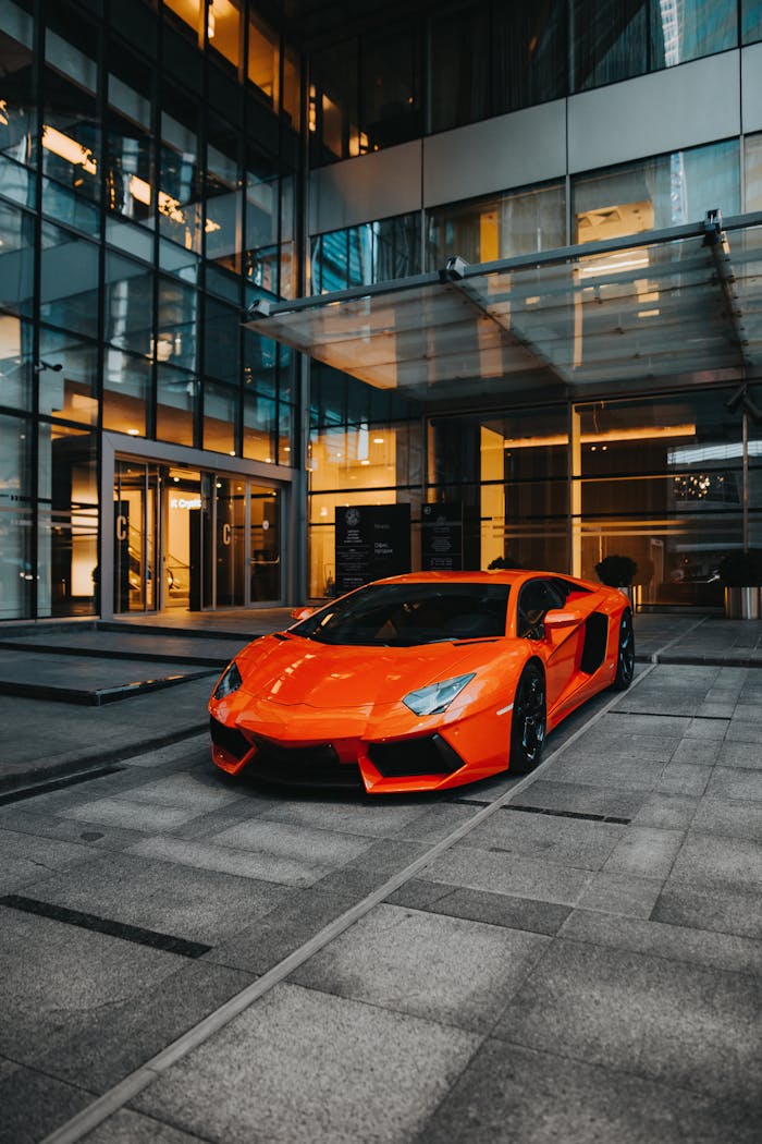 Dynamic shot of a Lamborghini Aventador parked in a modern architecture backdrop.